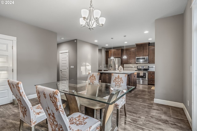 dining room featuring a notable chandelier and dark hardwood / wood-style floors