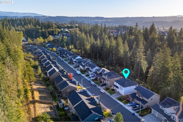 birds eye view of property with a mountain view