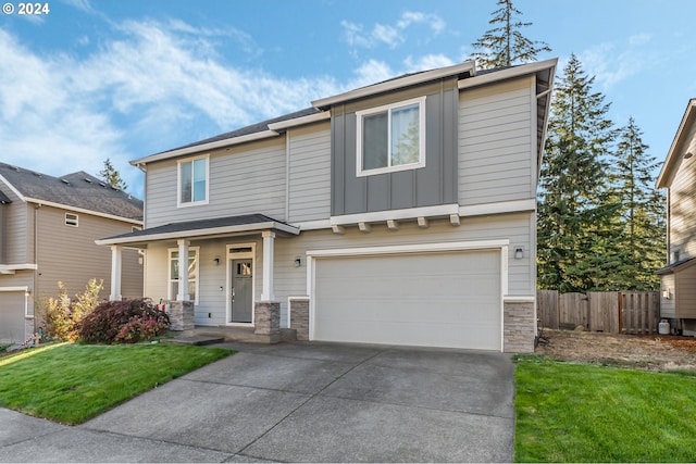 view of front of house with a front yard and a garage