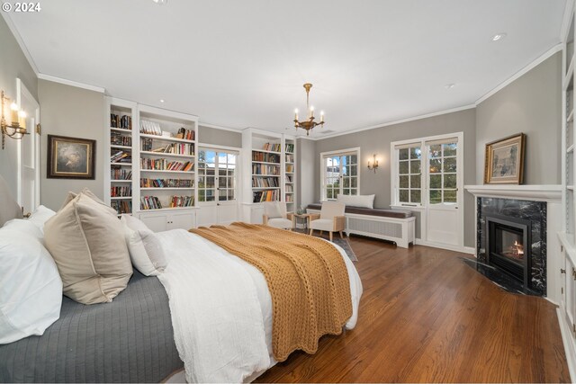 bedroom with a fireplace, radiator, ornamental molding, and dark hardwood / wood-style floors