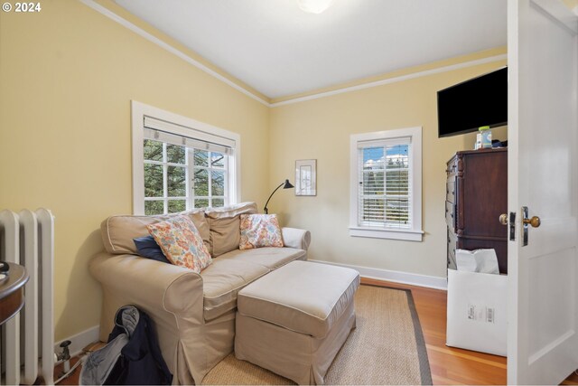 bedroom featuring beamed ceiling, wood walls, and carpet flooring