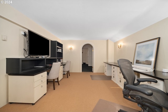 carpeted office space with lofted ceiling