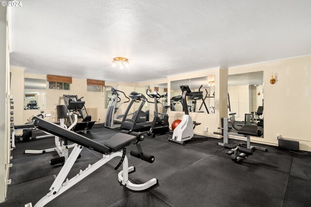 gym with a textured ceiling