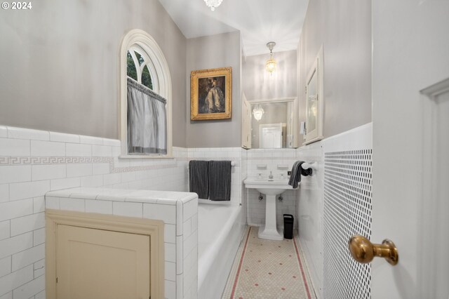 bathroom featuring tile walls and tile patterned flooring