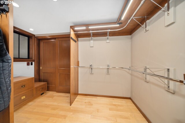 walk in closet featuring light wood-type flooring