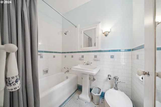 bathroom featuring tile patterned flooring, shower / bathtub combination with curtain, toilet, tile walls, and tasteful backsplash