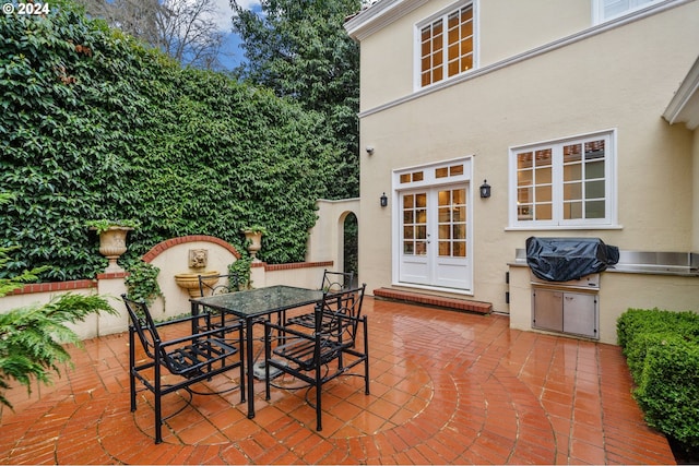 view of patio / terrace featuring area for grilling and french doors