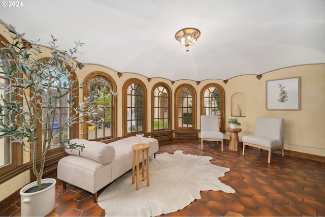 sitting room featuring lofted ceiling