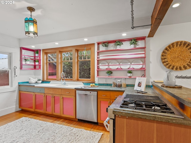 kitchen featuring decorative light fixtures, dishwasher, beamed ceiling, stove, and light hardwood / wood-style flooring