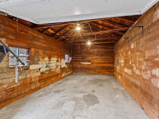 garage with wooden walls and wooden ceiling