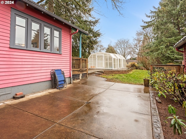 view of patio featuring an outbuilding