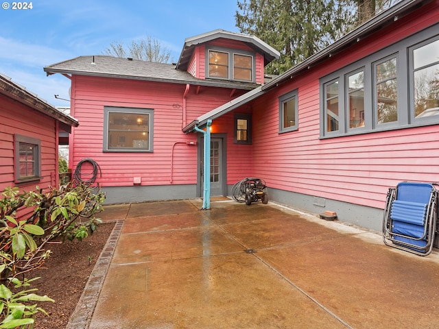 back of property featuring a patio