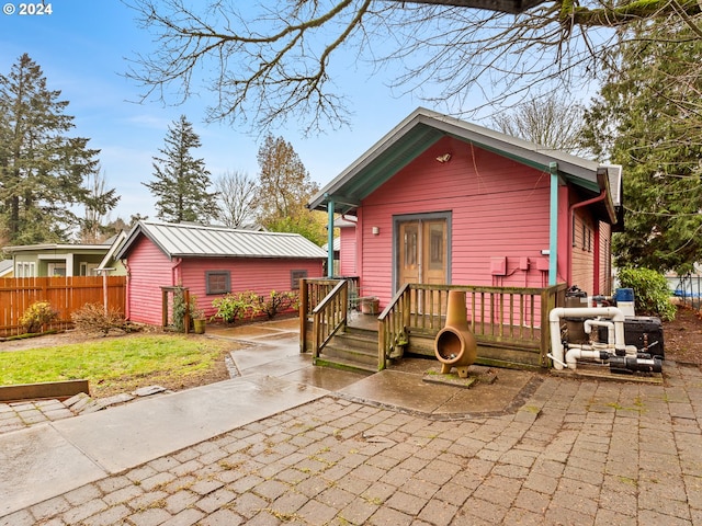 view of front of house with a patio area