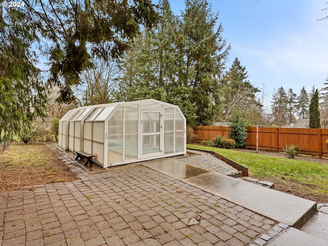 view of patio with an outbuilding