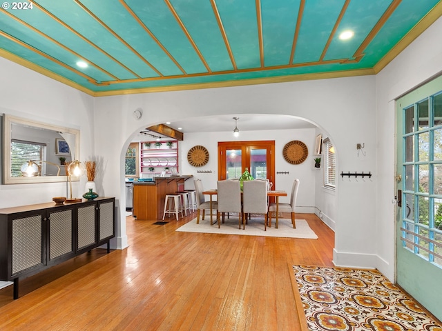 dining room with french doors and wood-type flooring