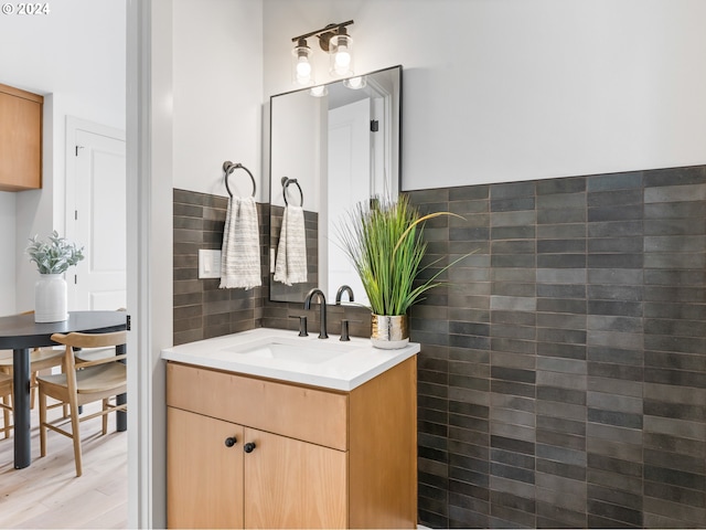 bathroom with vanity and wood-type flooring