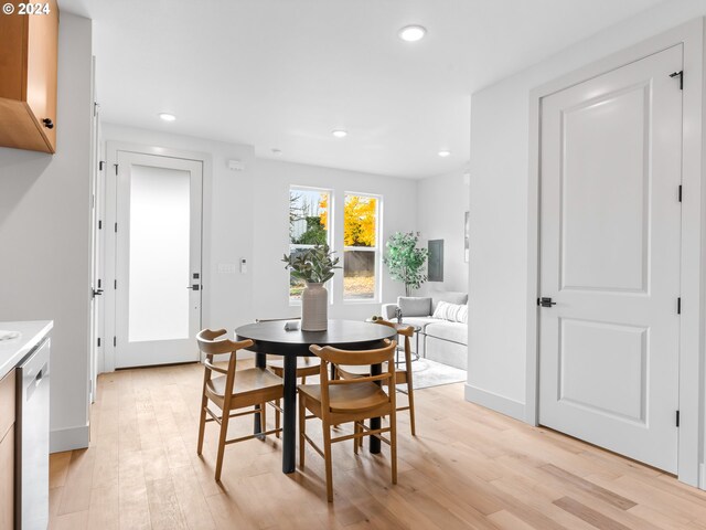 dining area featuring light wood-type flooring