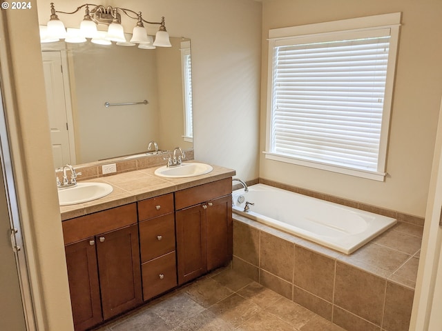 bathroom with tiled bath and vanity