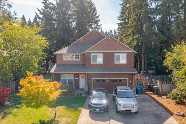 view of front facade featuring a garage and a front lawn