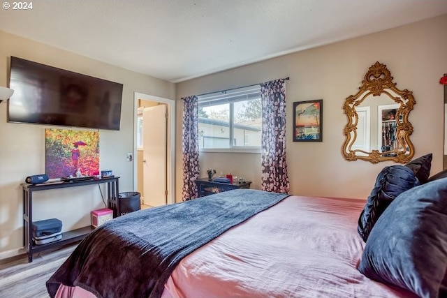 bedroom with light wood-style flooring