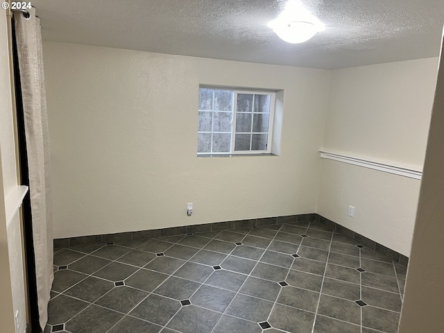 empty room with a textured ceiling