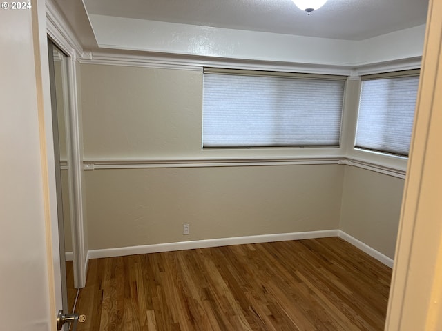 spare room with hardwood / wood-style flooring