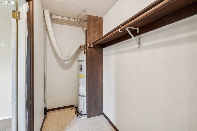 spacious closet featuring strapped water heater