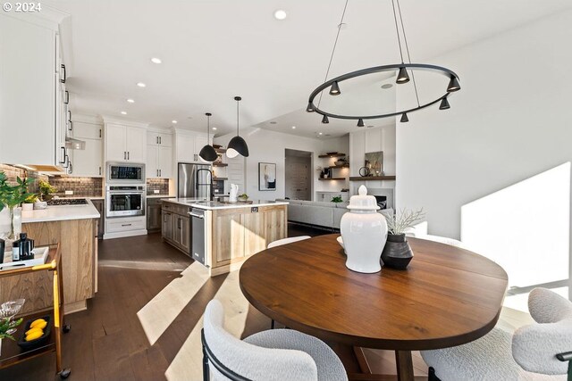 dining space featuring dark hardwood / wood-style floors