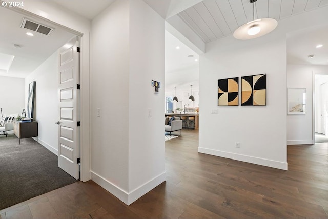 corridor featuring dark hardwood / wood-style floors