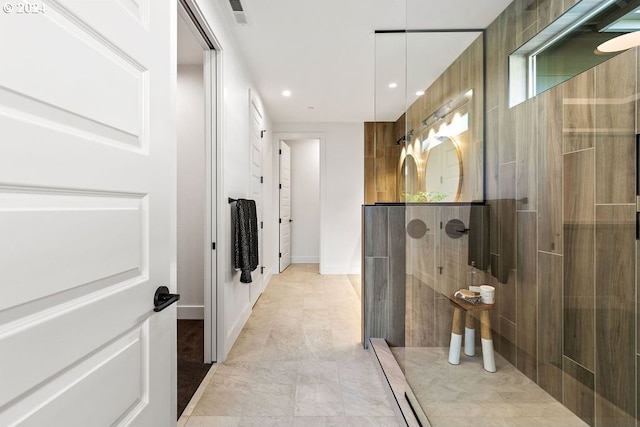 bathroom featuring a tile shower