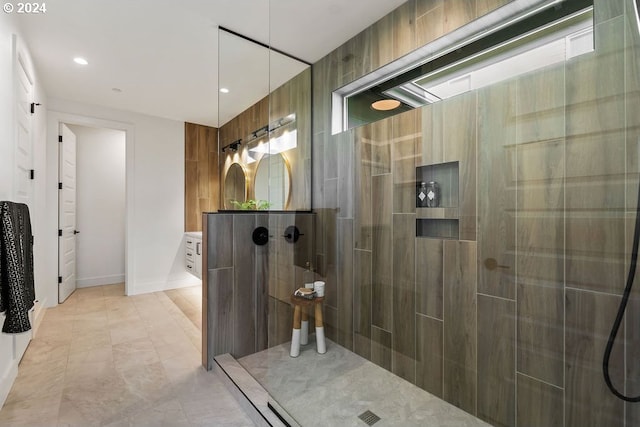 bathroom featuring vanity and a tile shower