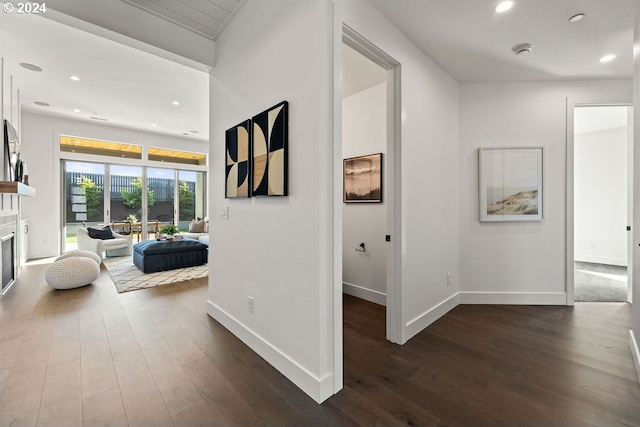 corridor with dark hardwood / wood-style floors