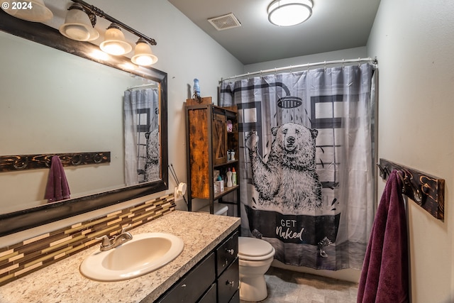 bathroom with decorative backsplash, vanity, a shower with shower curtain, and toilet