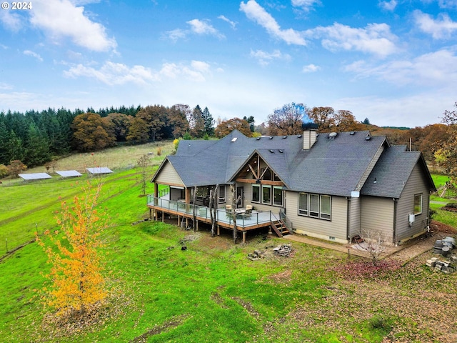 back of house with a deck