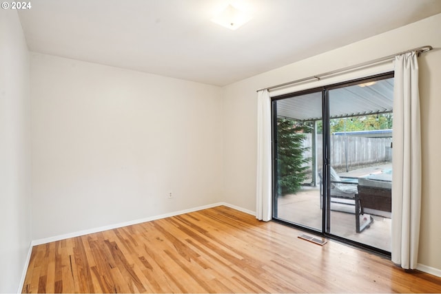 spare room featuring hardwood / wood-style flooring