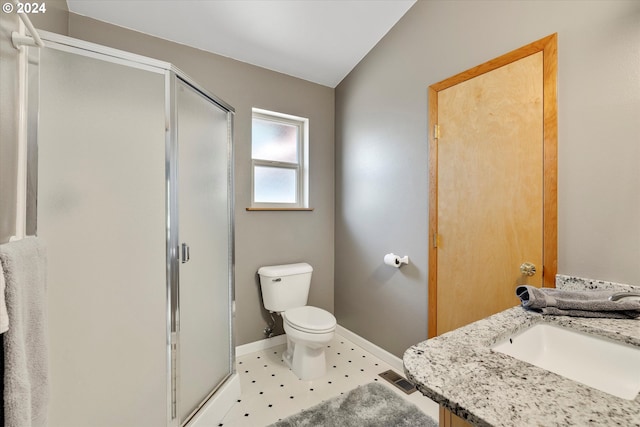 bathroom featuring visible vents, baseboards, toilet, a stall shower, and a sink
