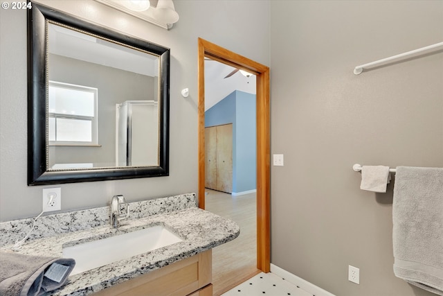 bathroom featuring vanity and baseboards