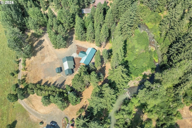 aerial view featuring a wooded view