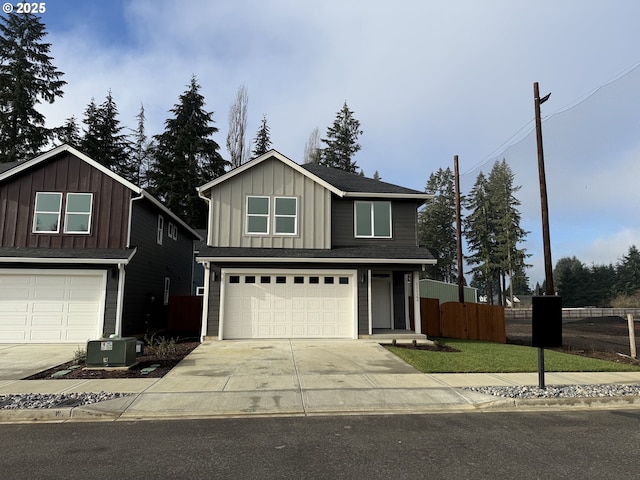 view of property with a garage and central AC