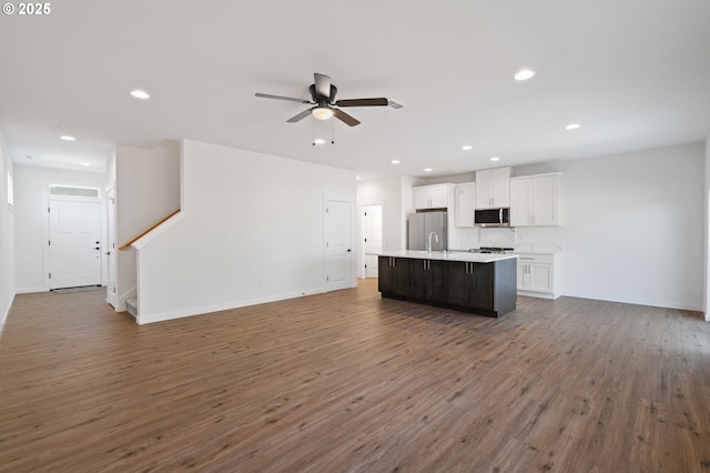 11122 NE 91st Ave, Vancouver, WA 98662 - kitchen with ceiling fan, wood finished floors, stainless steel appliances, white cabinetry, and an island with sink