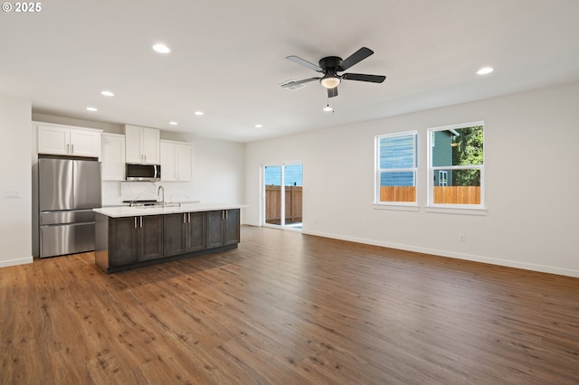 11122 NE 91st Ave, Vancouver, WA 98662 - kitchen featuring plenty of natural light, wood finished floors, a center island with sink, and stainless steel appliances