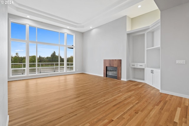 unfurnished living room with light wood-type flooring