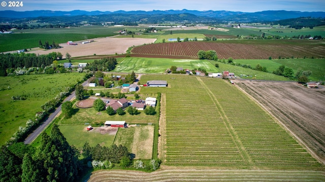 drone / aerial view featuring a mountain view and a rural view