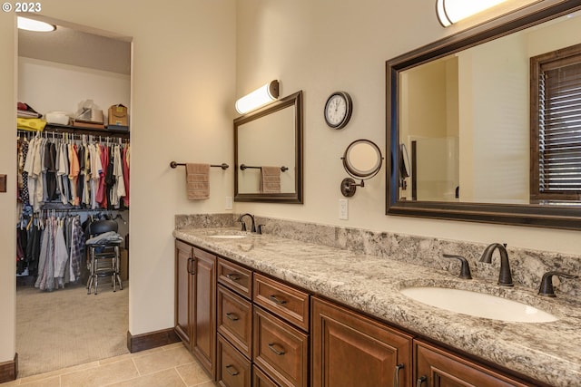 bathroom featuring vanity and tile patterned flooring