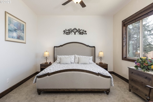 bedroom with ceiling fan and light carpet