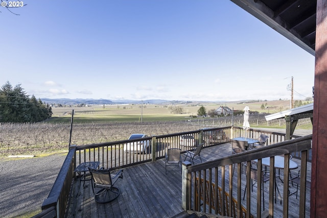 deck with a mountain view and a rural view