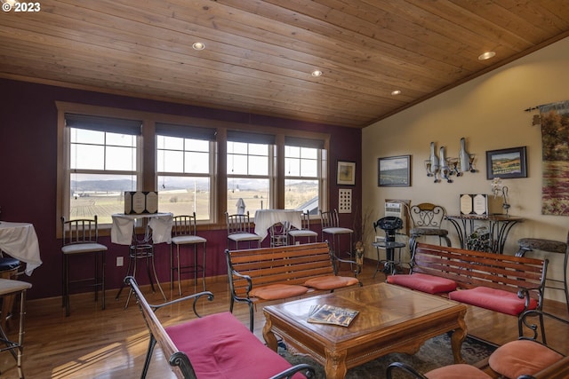 living room featuring wooden ceiling, hardwood / wood-style floors, crown molding, and lofted ceiling