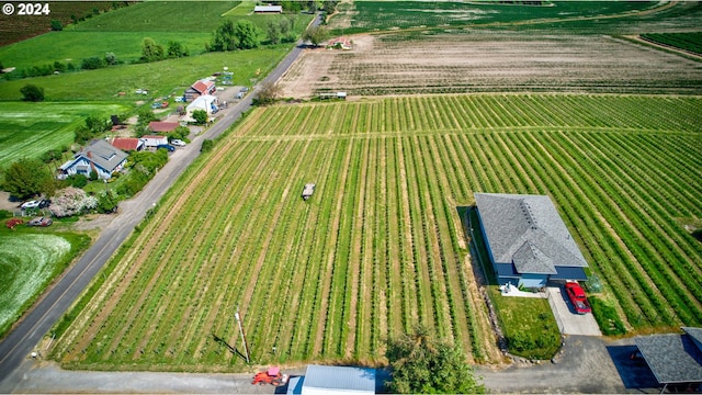 birds eye view of property featuring a rural view