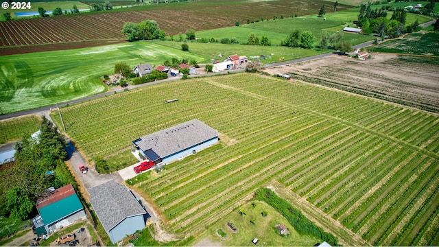 birds eye view of property with a rural view