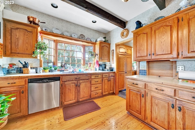 kitchen with sink, dishwasher, light wood-type flooring, decorative backsplash, and beam ceiling